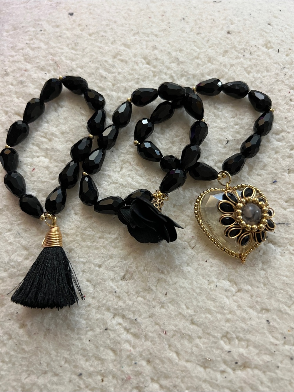 Black Beaded Heart Pendant with Tassel and Flower Accent